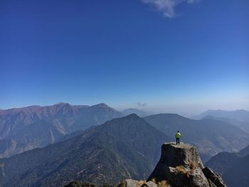 Scenic view of mountain against blue sky