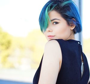 Portrait of beautiful young woman with dyed hair