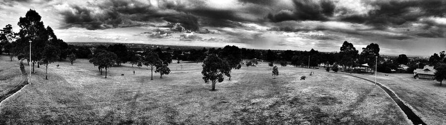 Silhouette of landscape against cloudy sky