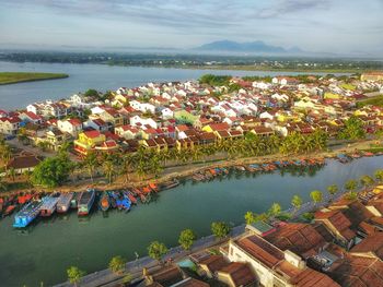 High angle view of river amidst buildings in town