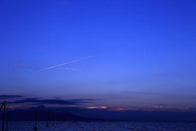 Scenic view of sea against sky at dusk