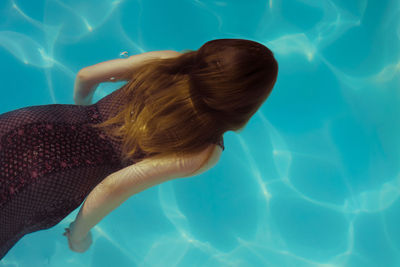 Woman swimming in pool