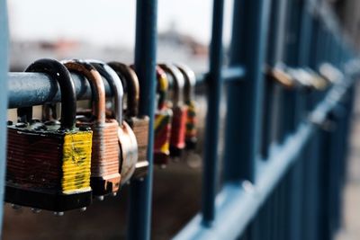 Close-up of padlocks on fence