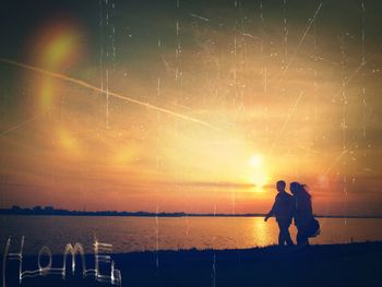Silhouette of people at sunset