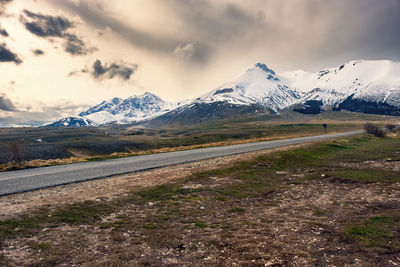 Scenic view of snowcapped mountains against sky during sunset