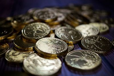 High angle view of coins on table