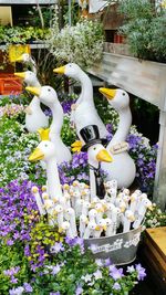 Close-up of flower statue against plants