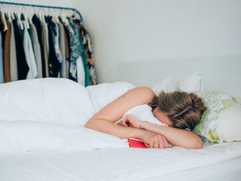 Young woman sleeping on bed