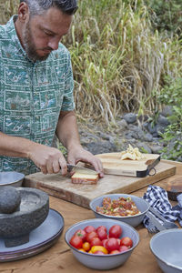 Charcuterie board being prepared by chef