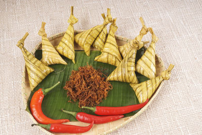 High angle view of vegetables and leaves on table