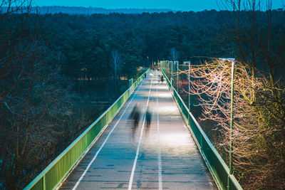 High angle view of people walking on footbridge