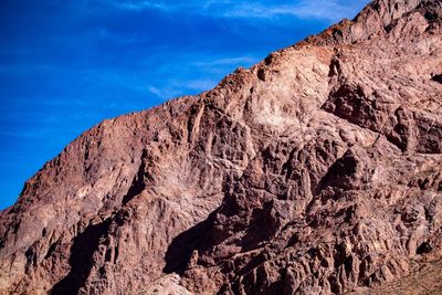 Low angle view of rock formations against sky