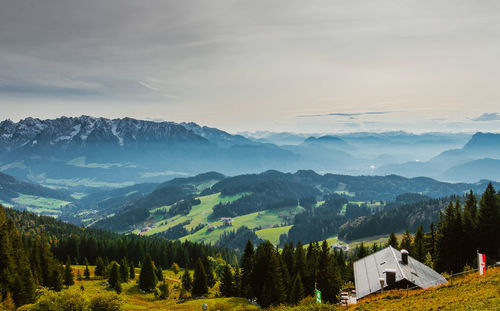 Scenic view of mountains against cloudy sky