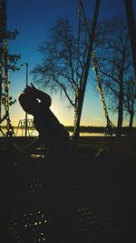 Silhouette horse against sky at sunset