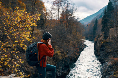 Man standing by plants during autumn