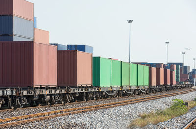 Stack of train at railroad station against clear sky