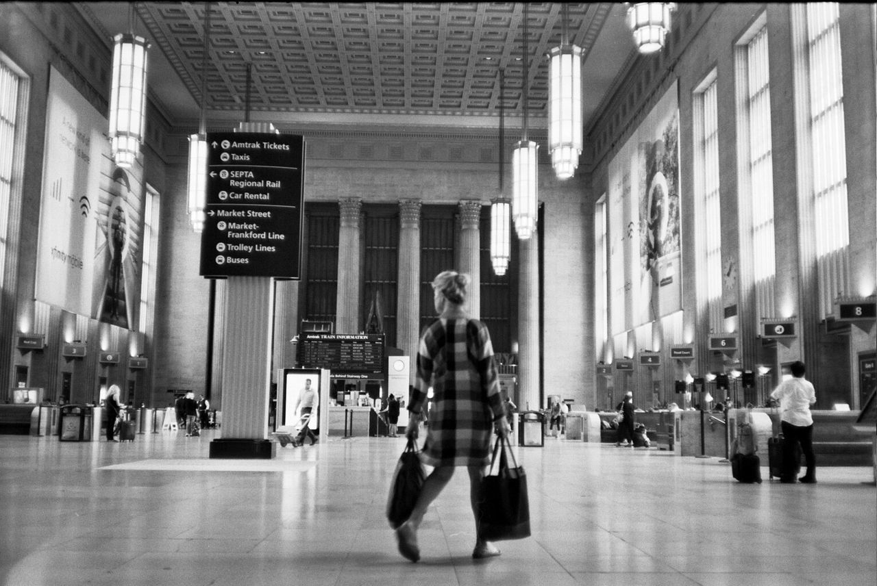 walking, incidental people, real people, architecture, women, built structure, indoors, full length, day, lifestyles, men, illuminated, people, city, adult, adults only