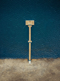 High angle view of information sign on wall