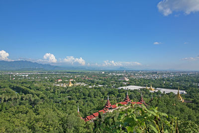 Aerial view of townscape against sky