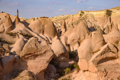 Rock formations in desert against sky