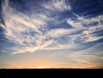 Scenic view of silhouette landscape against sky during sunset