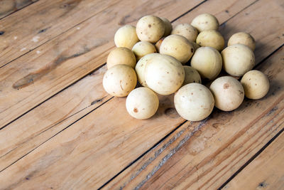 High angle view of eggs on wood