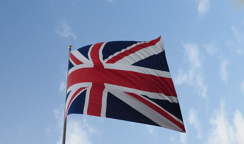 Low angle view of flag against sky