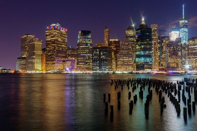 Illuminated city at waterfront