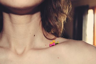 Rear view of shirtless woman