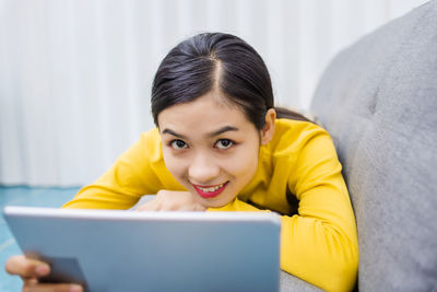 Portrait of woman using mobile phone