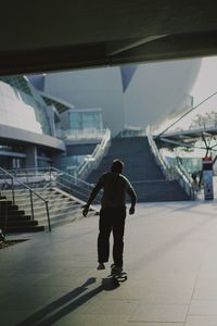 Rear view of man walking on street