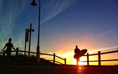 Silhouette of woman at sunset