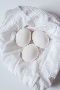 White eggs in white cloth.