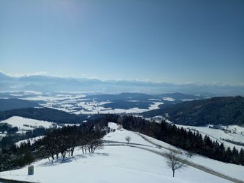 Scenic view of snow covered landscape against clear sky