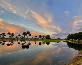 Scenic view of lake against sky during sunset