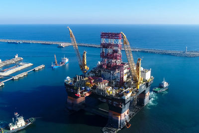 High angle view of offshore platform in sea against sky
