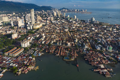 High angle view of buildings by sea