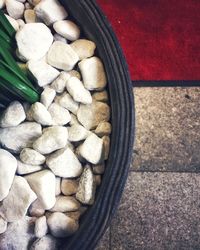 High angle view of pebbles in container
