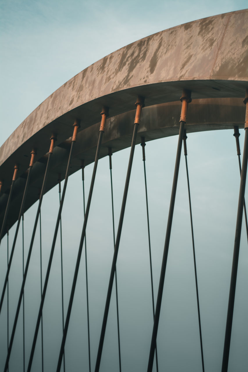 LOW ANGLE VIEW OF BRIDGE AGAINST BLUE SKY