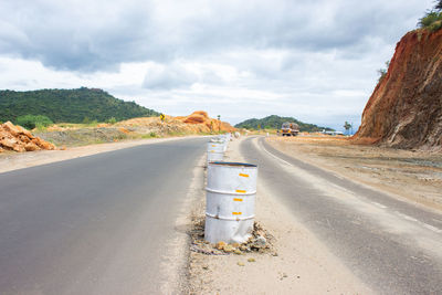 Road by street against sky