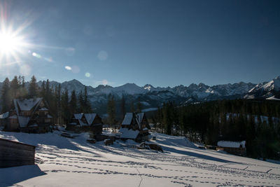 Panoramic view of landscape against clear sky during winter