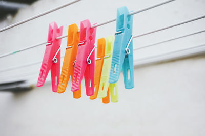 Close-up of clothespins on white background