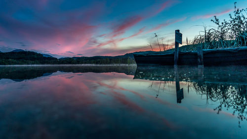 Scenic view of lake turnersee against sky at sunset