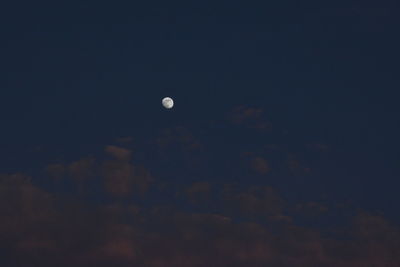 Low angle view of moon against sky at night