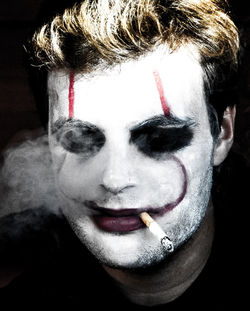 Close-up portrait of woman smoking