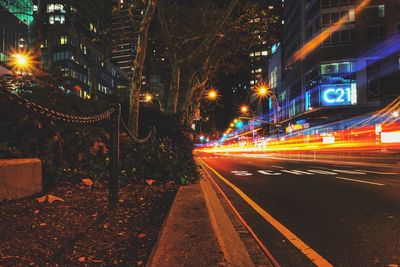 Light trails on road in city at night
