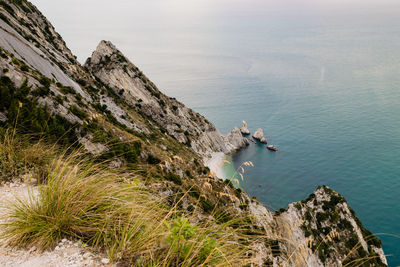 High angle view of rocks by sea