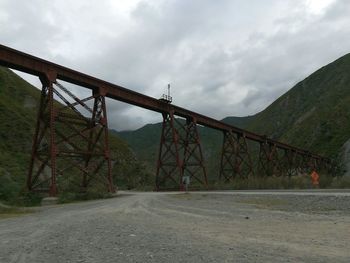 Bridge over road against sky