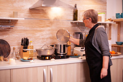 Side view of man working at home