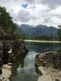 Scenic view of lake and mountains against sky